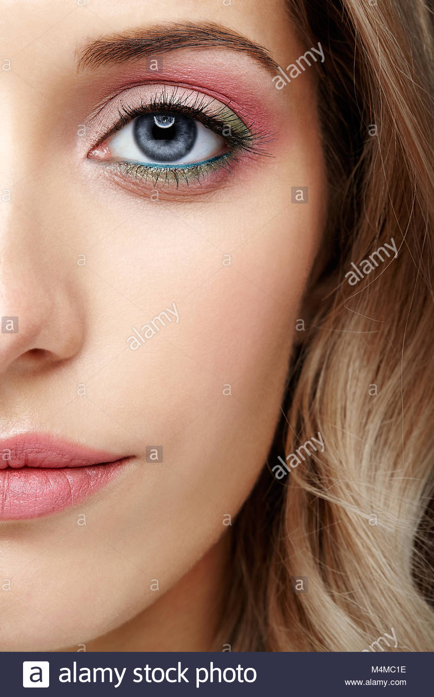 Half Eye Makeup Female Half Face With Pink And Green Blue Eyes Makeup Stock Photo
