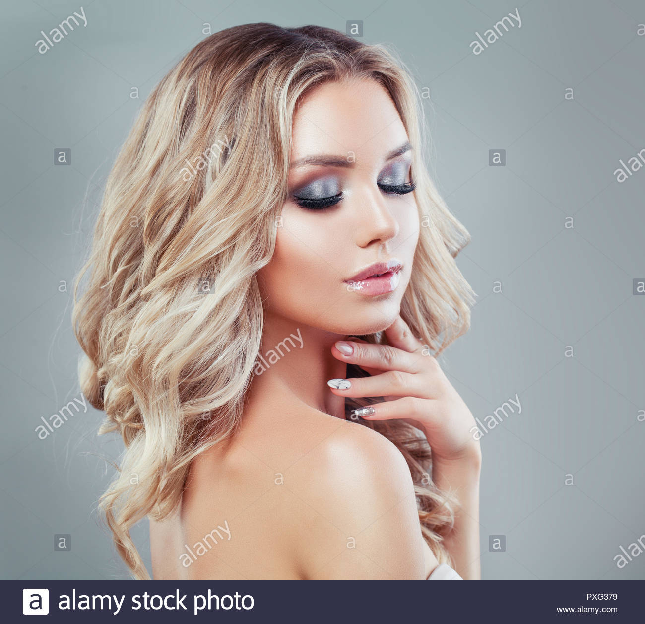 Makeup For Blue Eyes Blonde Hair Young Blonde Woman With Long Curly Hair And Makeup Eyes Closed