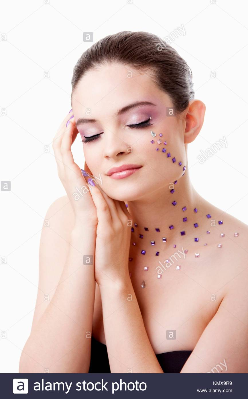 Rhinestones For Eyes Makeup Headshot Of A Beautiful Caucasian Woman With Purple Makeup And Stock